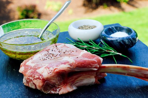 veal chop with marinade in bowl