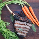 caveman veal chop sliced with carrots