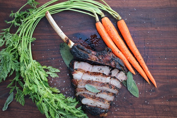 caveman veal chop sliced with carrots