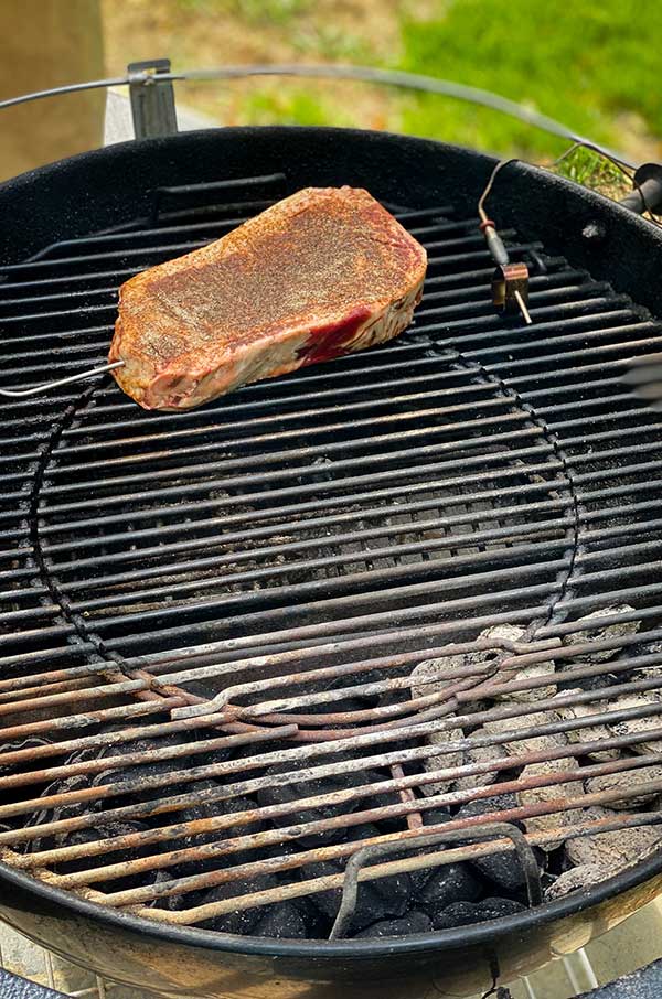 Grilling steak over indirect heat for reverse sear technique