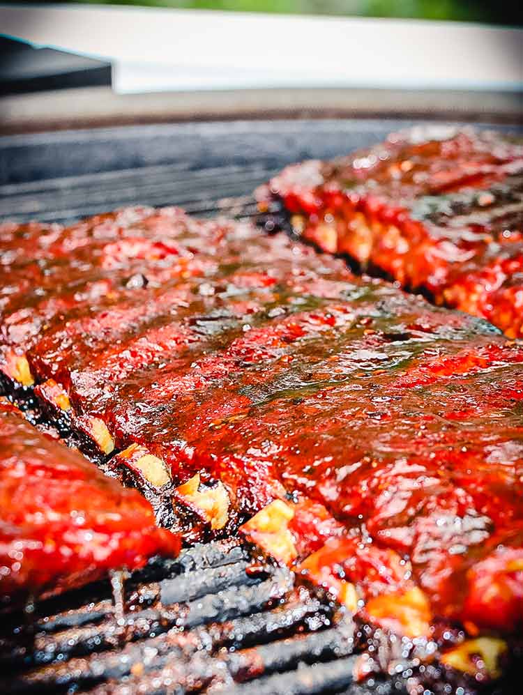 ribs on grill with bones peeking out