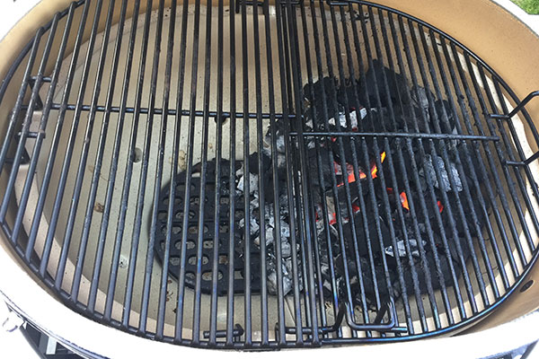 grill with charcoal on one side for two zone cooking