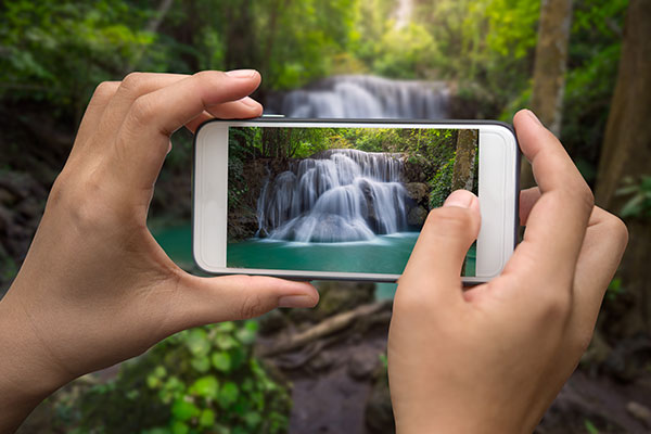 Reposters vs Creators creating photos with a smartphone