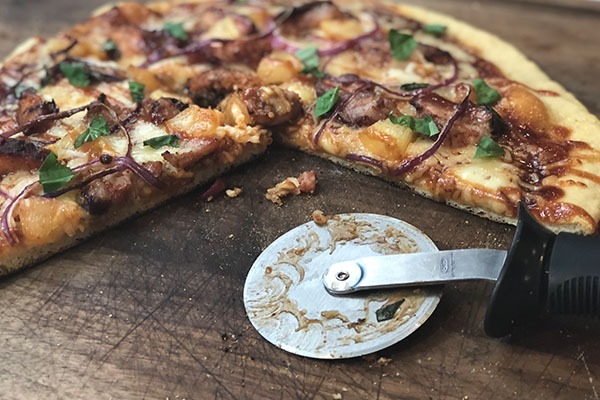 Head Country Hawaiian Baby Back Rib Pizza Sliced on Cutting Board
