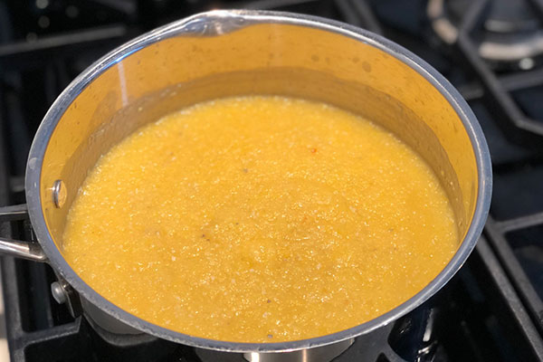 corn polenta cooking in pan