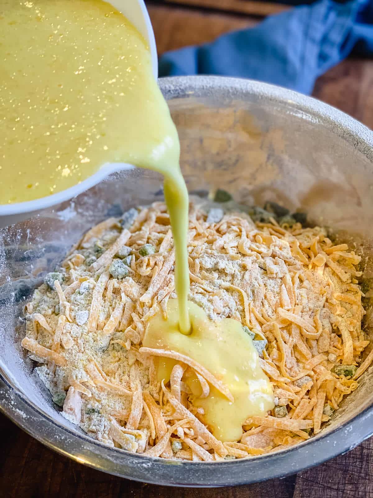 mixing ingredients for cheddar jalapeno cornbread