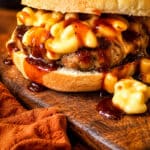 mac-n-cheese meatloaf burger drizzled with bbq sauce on a bun