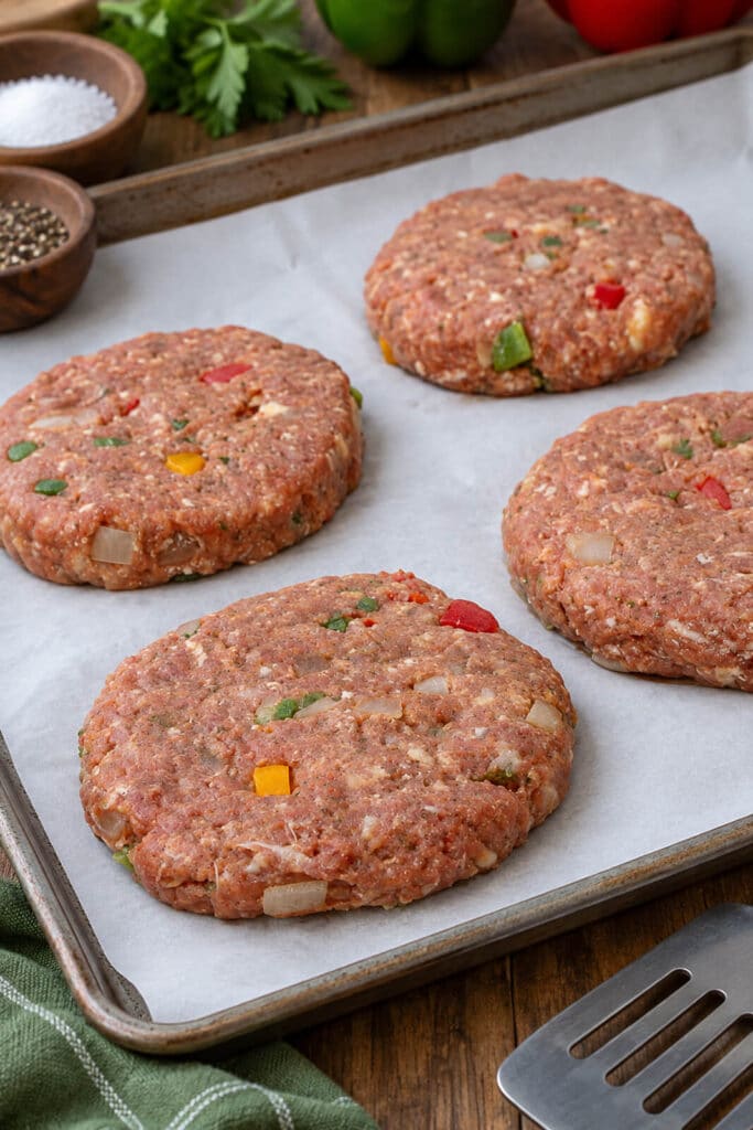 meatloaf burger patties formed on a parchment lined baking sheet
