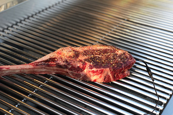 Tomahawk steak on grill
