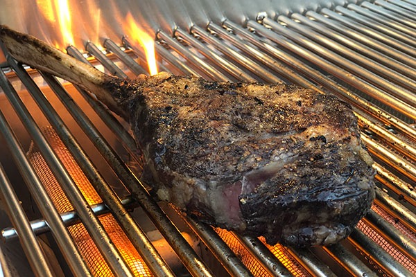 tomahawk steak over direct heat
