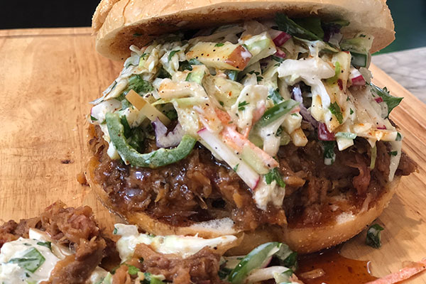 Apple radish and jalapeño slaw on pulled pork