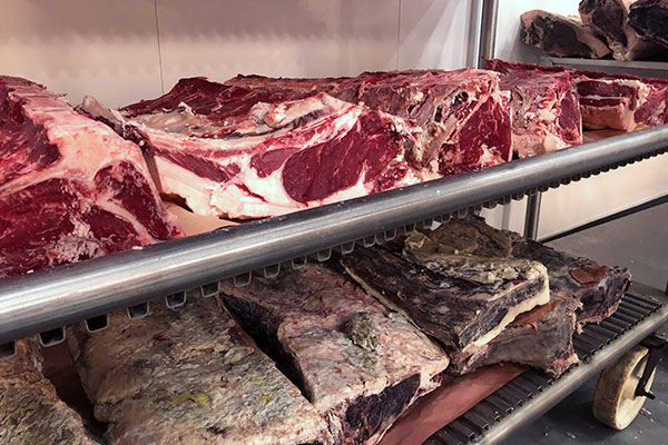 seven-hills-dry-aged-beef beef dry aging on racks at seven hills processing plant