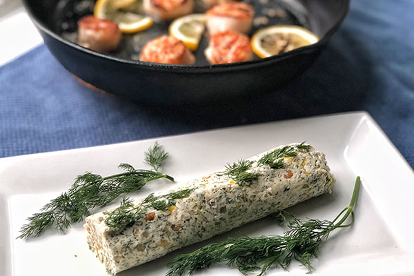 Roasted Garlic and Dill Butter on a platter with dill garnish