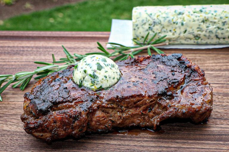 compound herb butter for steak on a New York strip steak