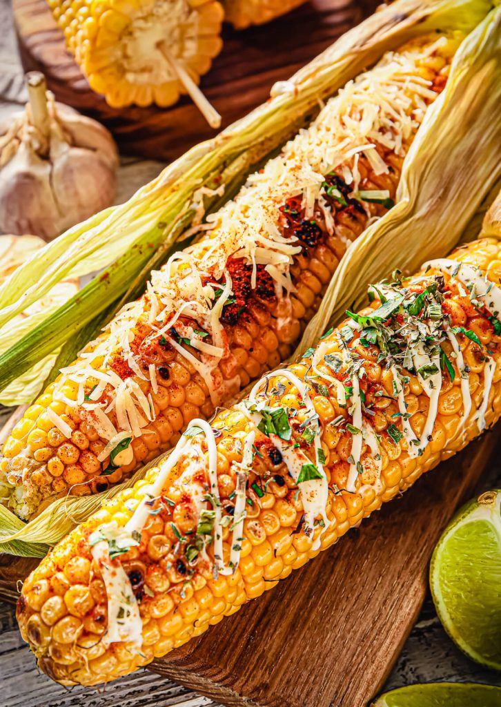 Mexican street corn with dressing and limes 