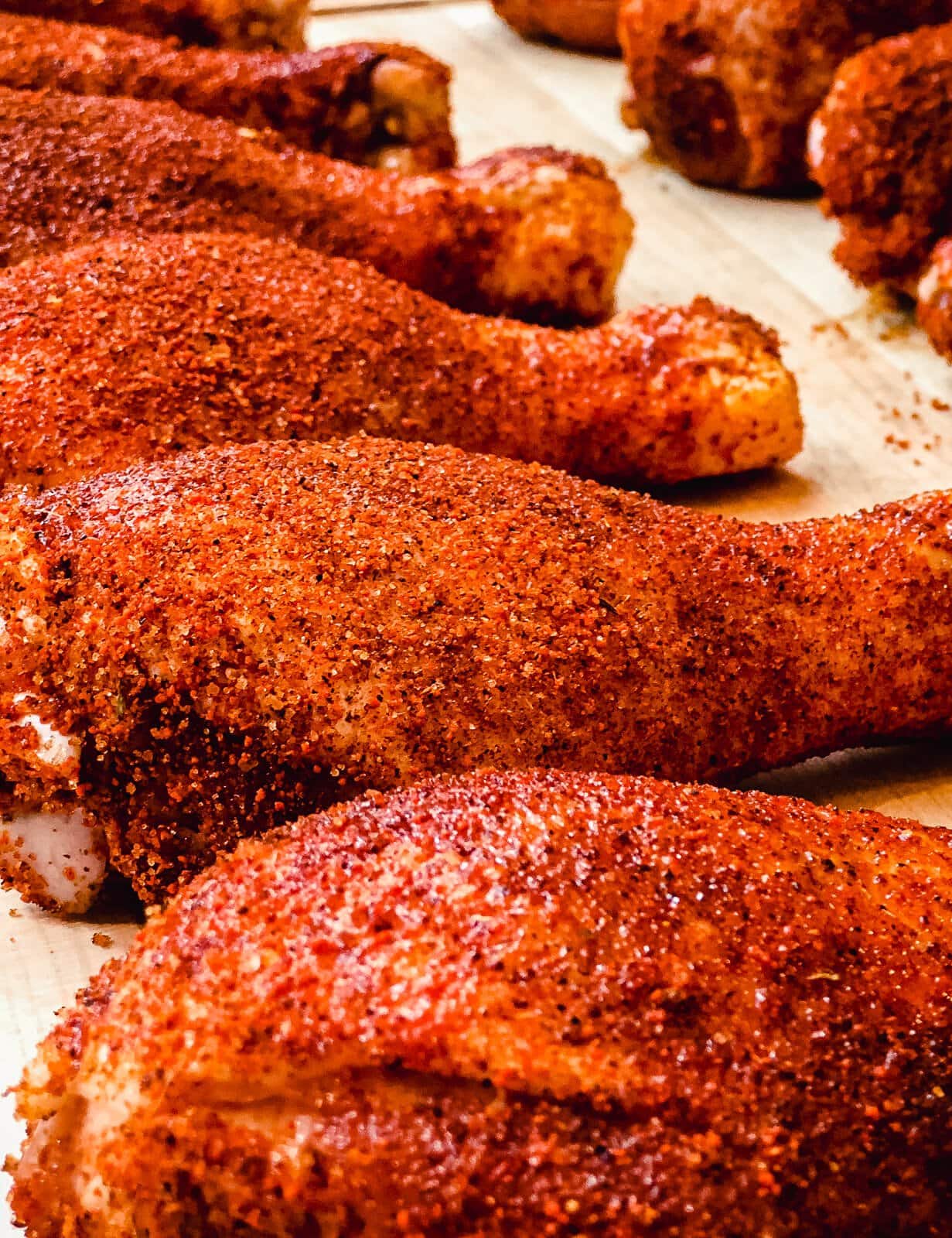 chicken drumsticks seasoned and ready for the smoker