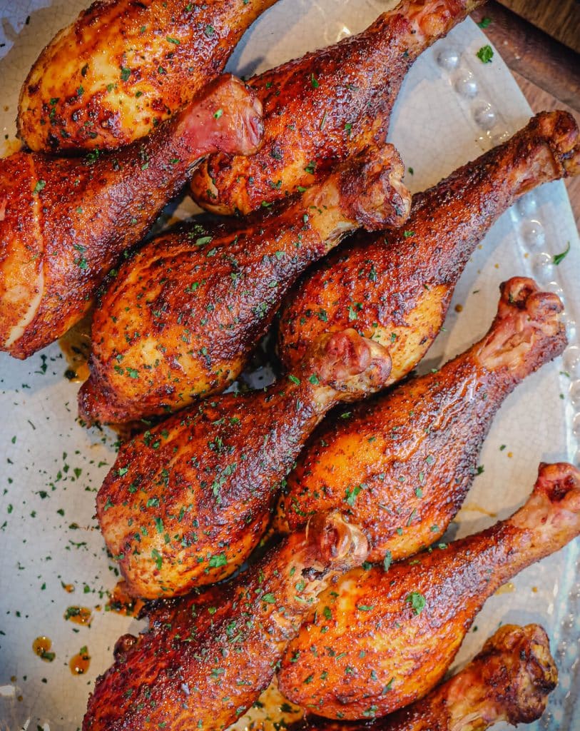 smoked chicken drumsticks on a platter