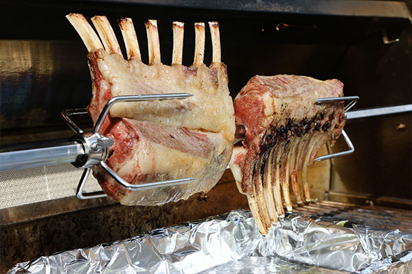 Rosemary Crusted Lamb cooking on rotisserie