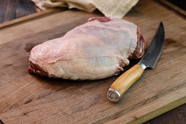 Raw boneless leg of lamb ready to prep for the Rotisserie Boneless Leg of Lamb recipe