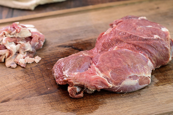 Removing the skin from a boneless leg of lamb for the Rotisserie Boneless Leg of Lamb recipe