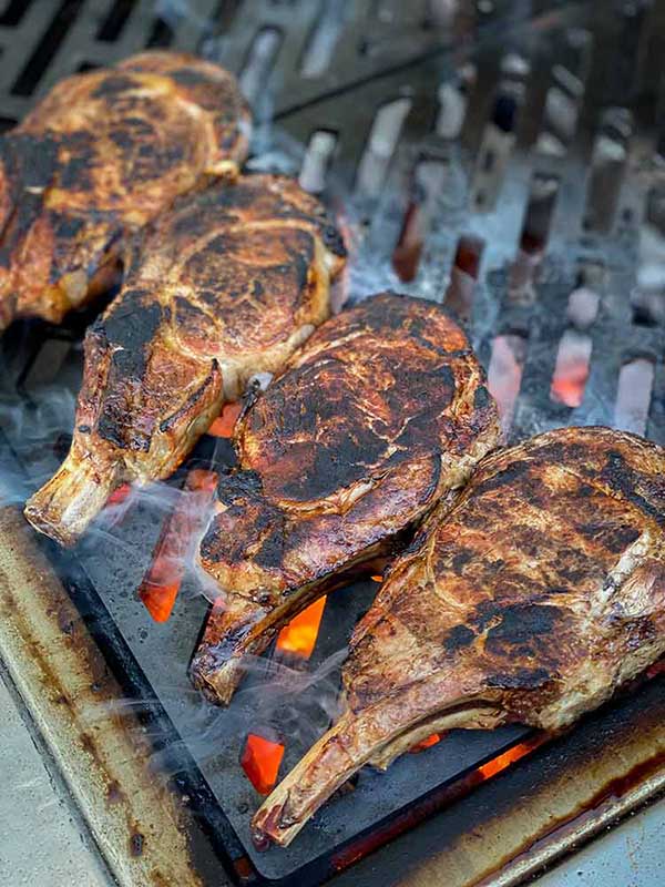 charred veal chops on the grill