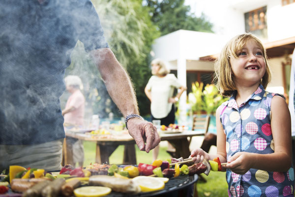 Memorial Day Grilling Guide: Quick and Easy Tips for Your Cookout, girl grilling with her dad