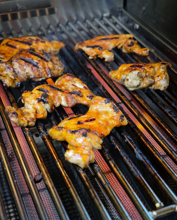 Grilled Honey Sriracha Chicken Thighs Recipe chicken thighs on the grill