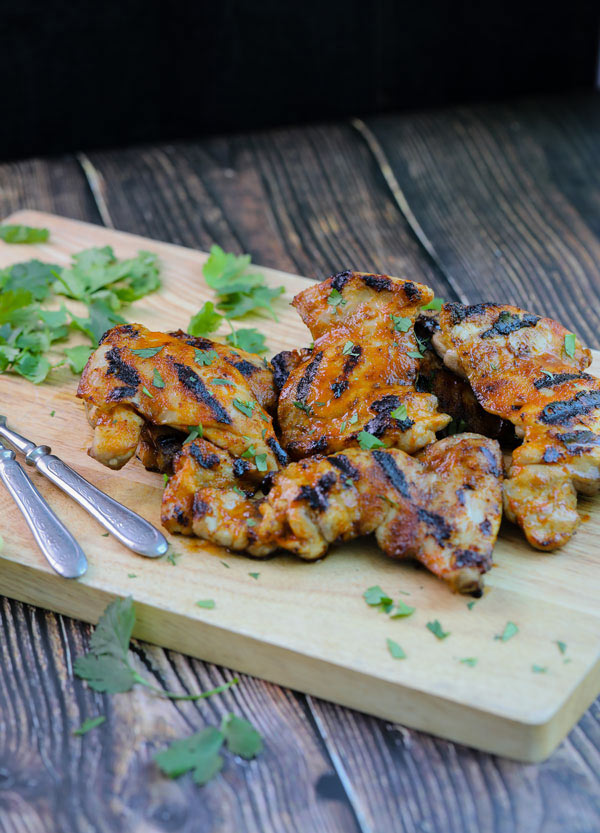 Cooked chicken thighs ready to serve for the Grilled Honey Sriracha Chicken Thighs Recipe