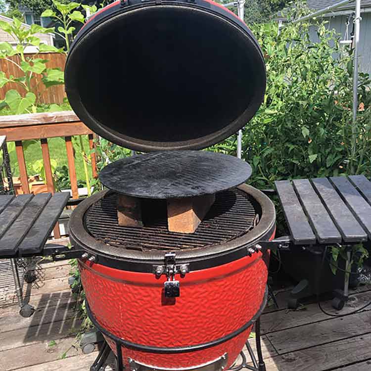 Pizza stone elevated in the kamado grill