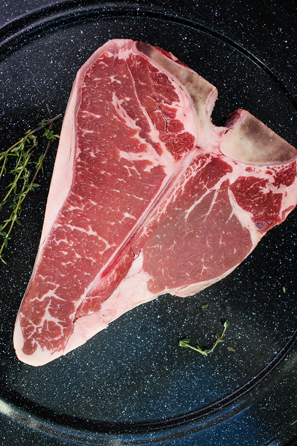 porterhouse steak on a black platter