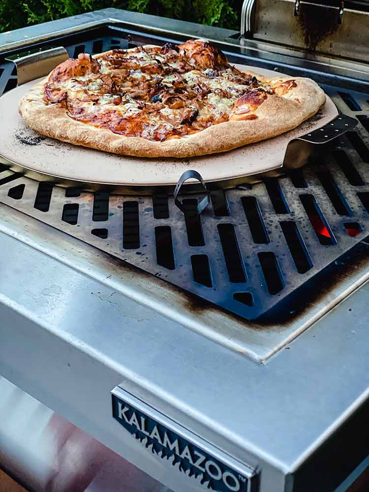 pizza with toppings, grilled on a Kamado Grill