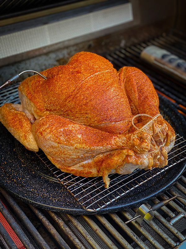 Whole turkey from Omaha Steak trussed and on the grill