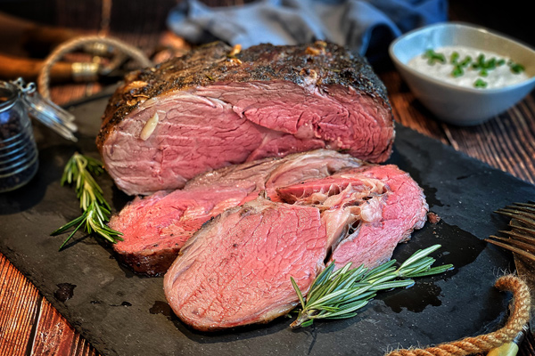 Smoked-and-Seared-Prime-Rib-Featured smoked and seared prime rib sliced and ready to serve