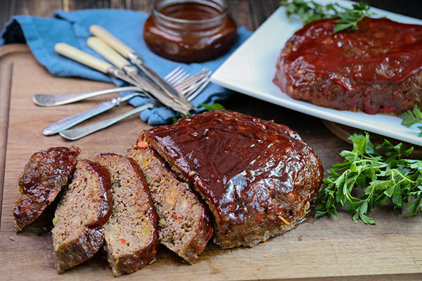 Smoked-BBQ-Meatloaf-Recipe-Feature-Image Sliced smoked meatloaf ready to serve at dinner