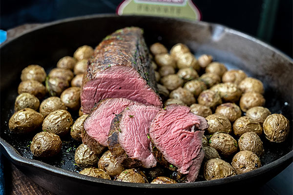 Omaha Steaks chateaubriand sliced over roasted potatoes