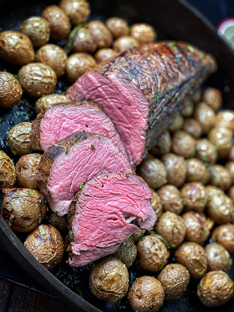 sliced chateaubriand in cast iron pan