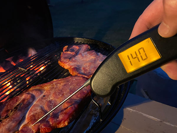ThermoWorks Thermapen MK4 checking the temperature of grilled meat