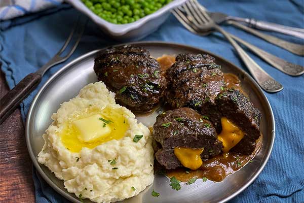 Grilled Cheese Stuffed Salisbury Steak plated and ready to eat