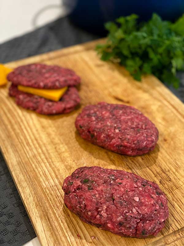 Ground beef patties stuffed with cheese