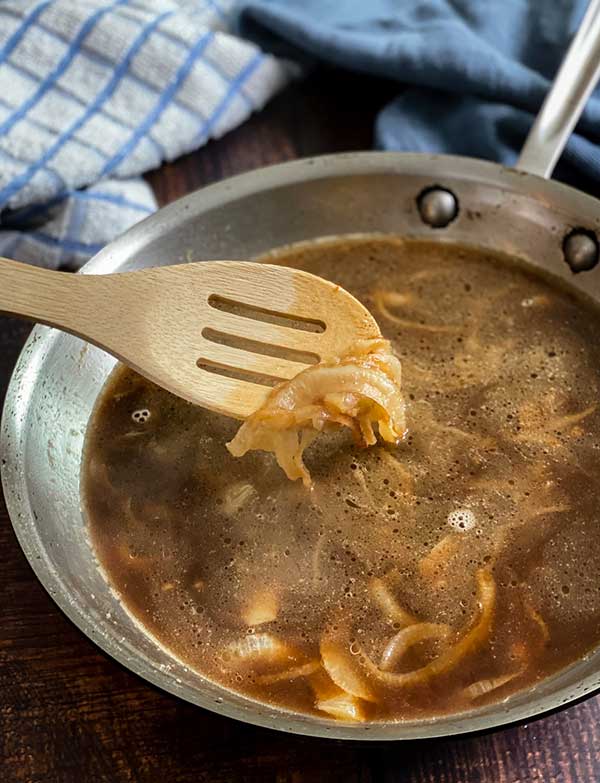 broth cooking onions for Grilled Cheese Stuffed Salisbury Steak