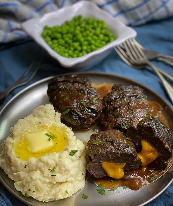 Grilled Cheese Stuffed Salisbury Steak plated and ready to eat