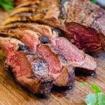 rack of lamb sliced on a cutting board