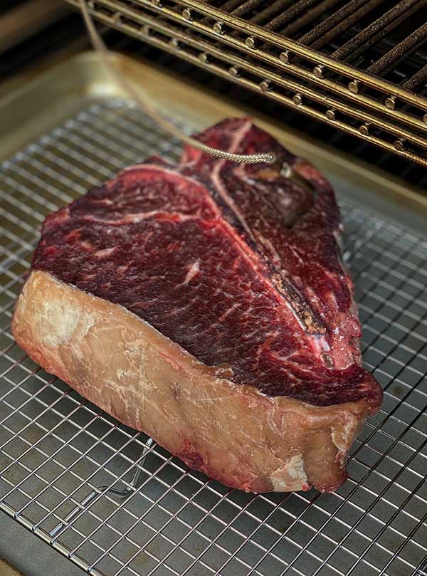 Dry brined steak on a rack