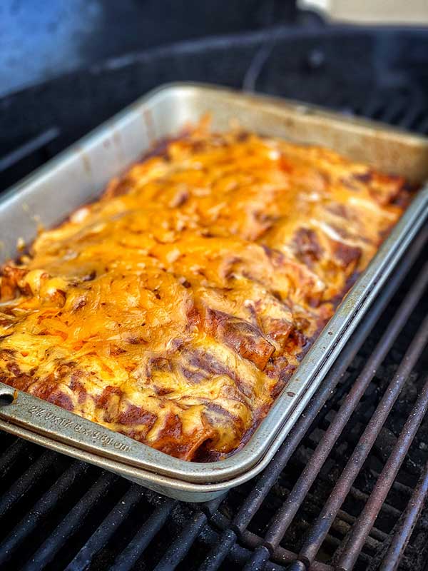 A pan of smoked chicken and cheese enchiladas