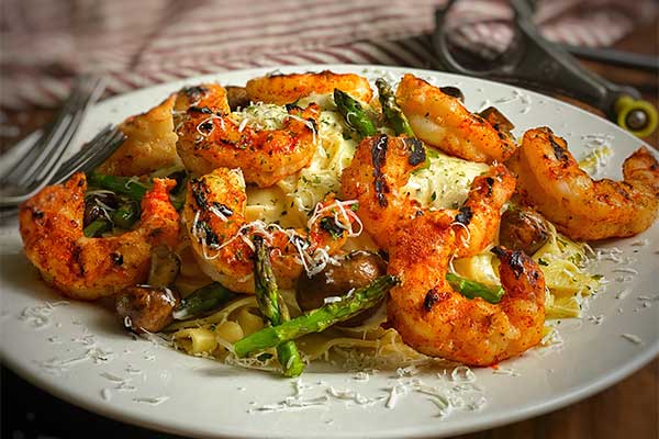 Grilled Argentinian Shrimp with Fettuccine Alfredo plated and ready to serve