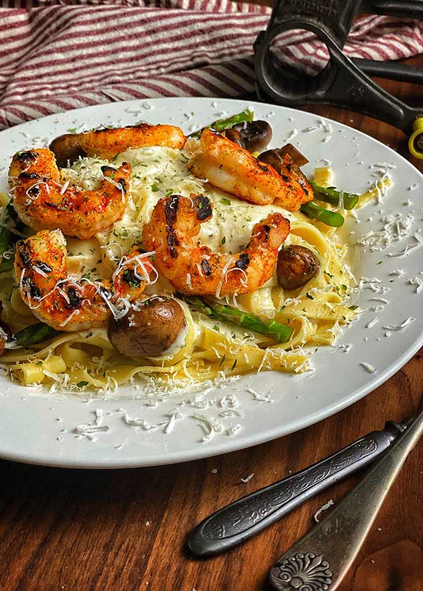 Grilled Argentinian Shrimp with Fettuccine Alfredo ready to serve