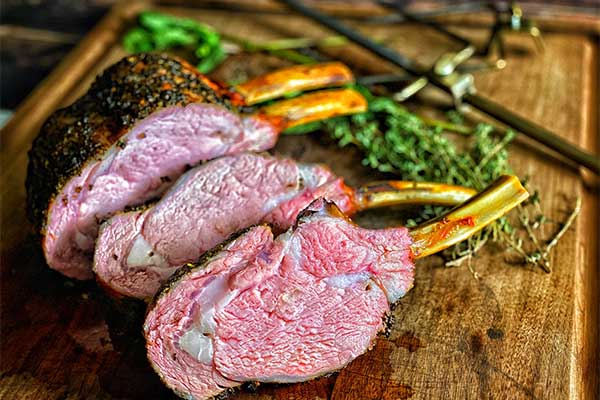 Grilled Herb Crusted Rack of Veal sliced and ready to serve