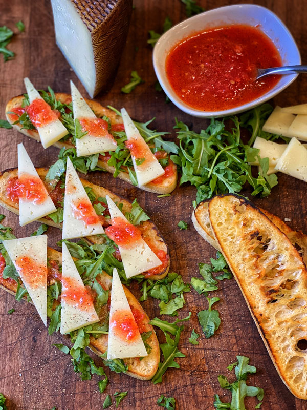 Grilled Ciabatta Bread with Tomato Dip and Manchego Cheese ready to serve