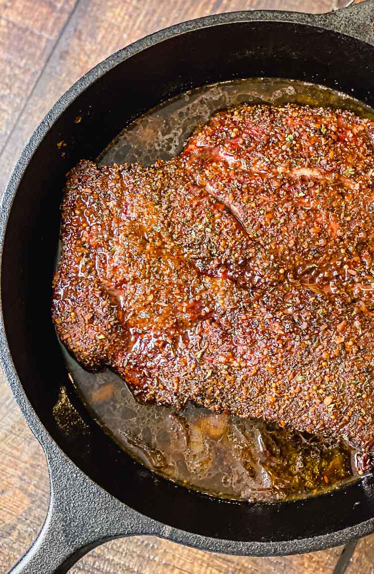 image of smoked chuck roast in a cast iron pan