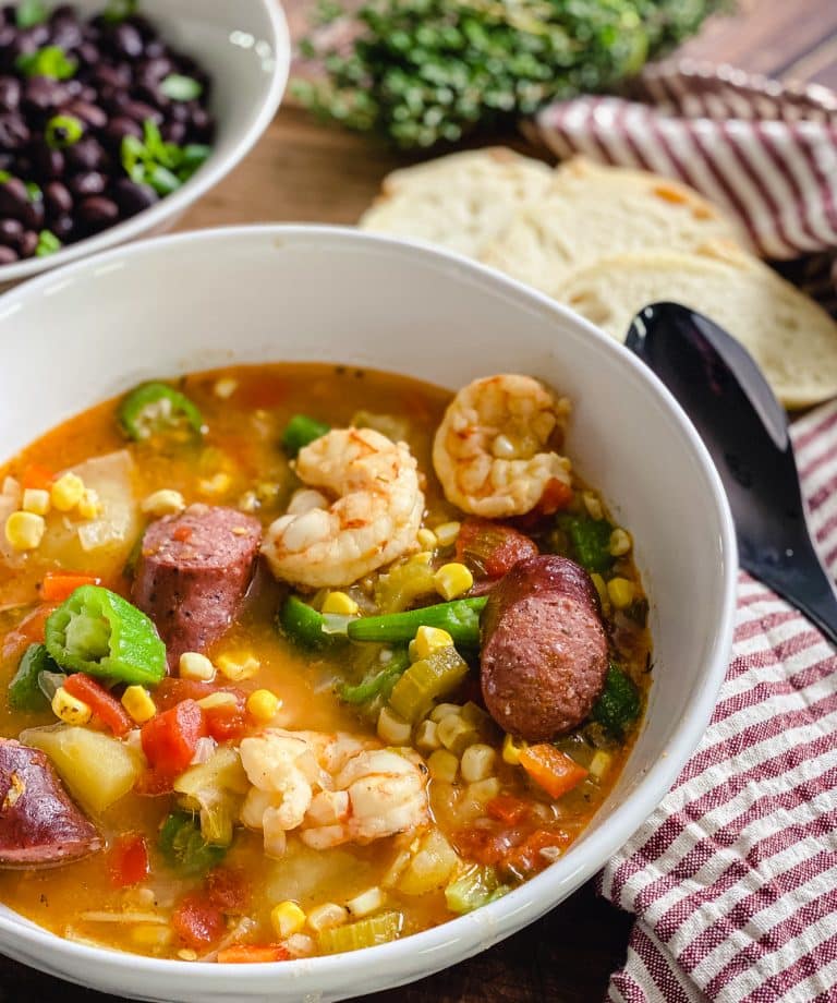 low country boil in a bowl with some bread